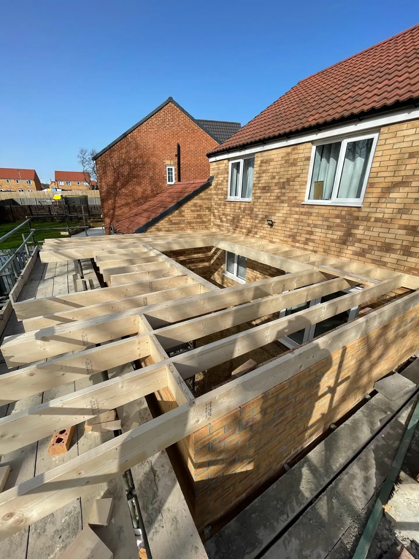 Timber joists across a new single-storey extension