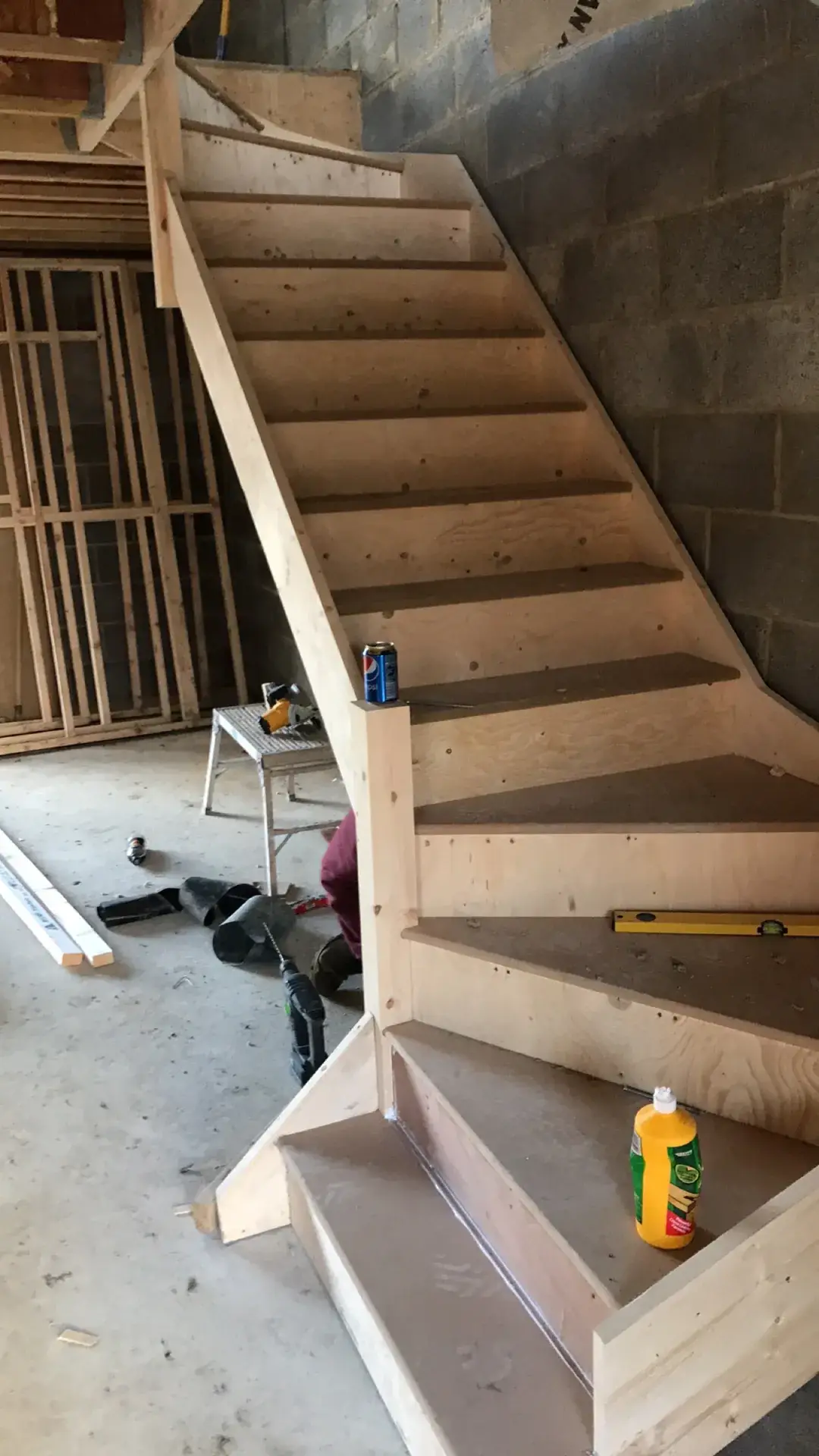 A new timber staircase fitted in a block-built shell